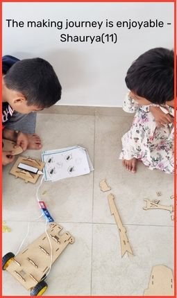 kids assembling havi robotic car